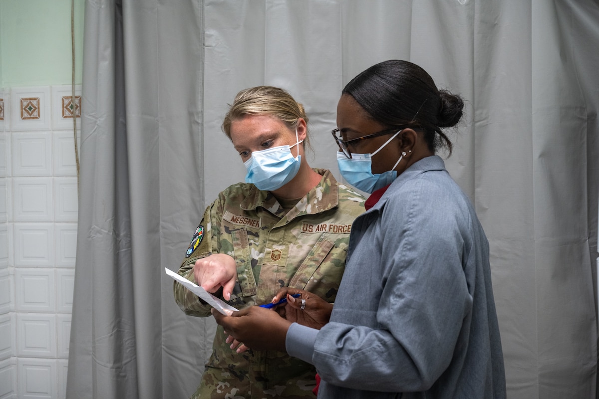 Image of an Airman treating a patient.