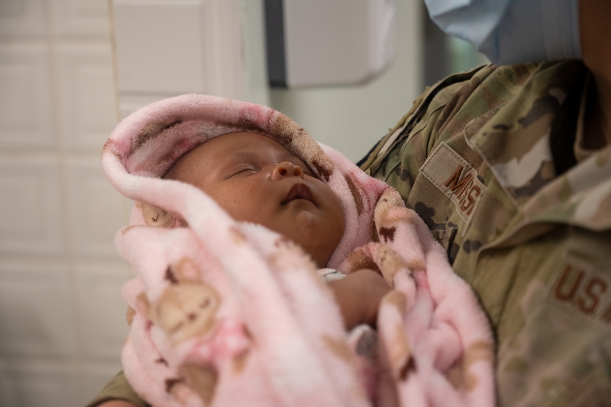 Image of an Airman treating a patient.