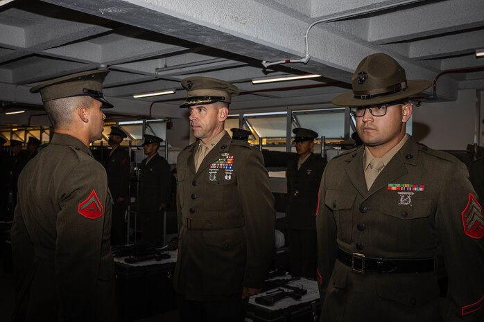 U.S. Marine Corps Lt. Col. James R. Smith, the commanding officer of 2nd Recruit Training Battalion, inspects Lance Cpl. Andrew Jenkins with Hotel Company, 2nd Recruit Training Battalion, during a battalion commander inspection at Marine Corps Recruit Depot San Diego, California, April 3, 2024. The battalion commander’s inspection surveys new Marines knowledge, bearing, and attention to detail and is one of their last tests before graduating. (U.S. Marine Corps photo by Cpl. Sarah M. Grawcock)