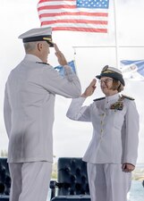 Adm. Stephen Koehler, commander of U.S. Pacific Fleet, left, salutes Chief of Naval Operations Adm. Lisa Franchetti during the U.S. Pacific Fleet change of command ceremony at Joint Base Pearl Harbor-Hickam.