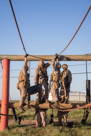 U.S. Marine Corps recruits with Alpha Company, 1st Recruit Training Battalion, navigate an obstacle during the Crucible at Marine Corps Base Camp Pendleton, California, April 2, 2024. The Crucible is a 54-hour exercise where recruits apply the knowledge and training they’ve learned throughout recruit training to earn the title of United States Marine. (U.S. Marine Corps photo by Lance Cpl. Janell B. Alvarez)