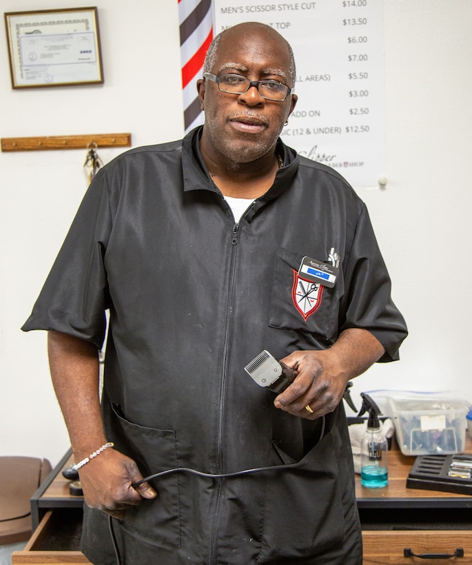Phendell Johnson, known simply as "Jay", the base barber for Marine Corps Logistics Base Barstow, takes a moment away from his duties at the barbershop aboard MCLB Barstow Feb. 27, 2024. Jay has been working aboard the installation for a total of 24 years, and cuts hair for military and civilian customers alike.