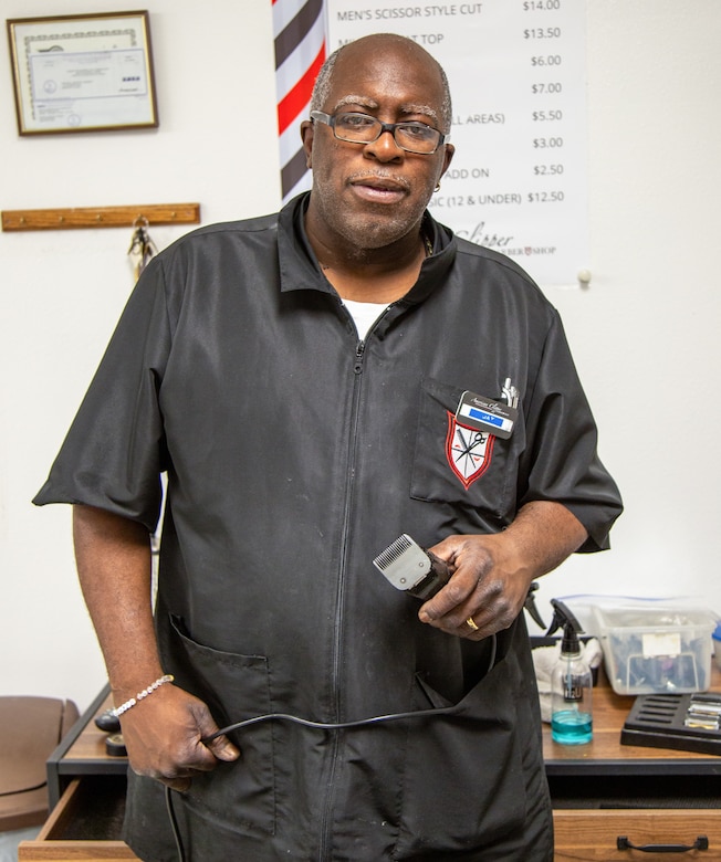 Phendell Johnson, known simply as "Jay", the base barber for Marine Corps Logistics Base Barstow, takes a moment away from his duties at the barbershop aboard MCLB Barstow Feb. 27, 2024. Jay has been working aboard the installation for a total of 24 years, and cuts hair for military and civilian customers alike.