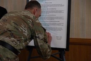 U.S. Army Maj. Gen. John V. Meyer III, the commanding general of the 1st infantry Division and Fort Riley, signs the annual SAAPM proclamation, March 28, 2024, at Riley’s Community Center. It is a Fort Riley tradition for the commanding general to sign the proclamation. (U.S. Army photo by Spc. Koltyn O’Marah)