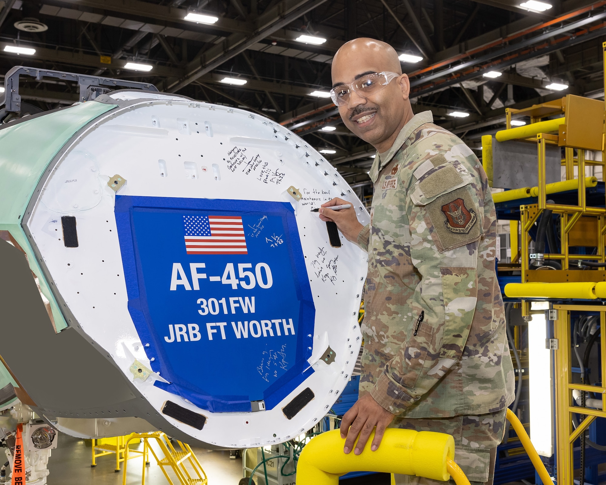 Air Force Reserve Command Chief Master Sgt. Israel Nunez etches his name on the inaugural F-35 Lightning II for the 301st Fighter Wing, affirming the enlisted force's pivotal role in ushering in a new era of airpower and readiness for Air Force Reserve Command. (Photos courtesy of Lockheed Martin Aeronautics Company)