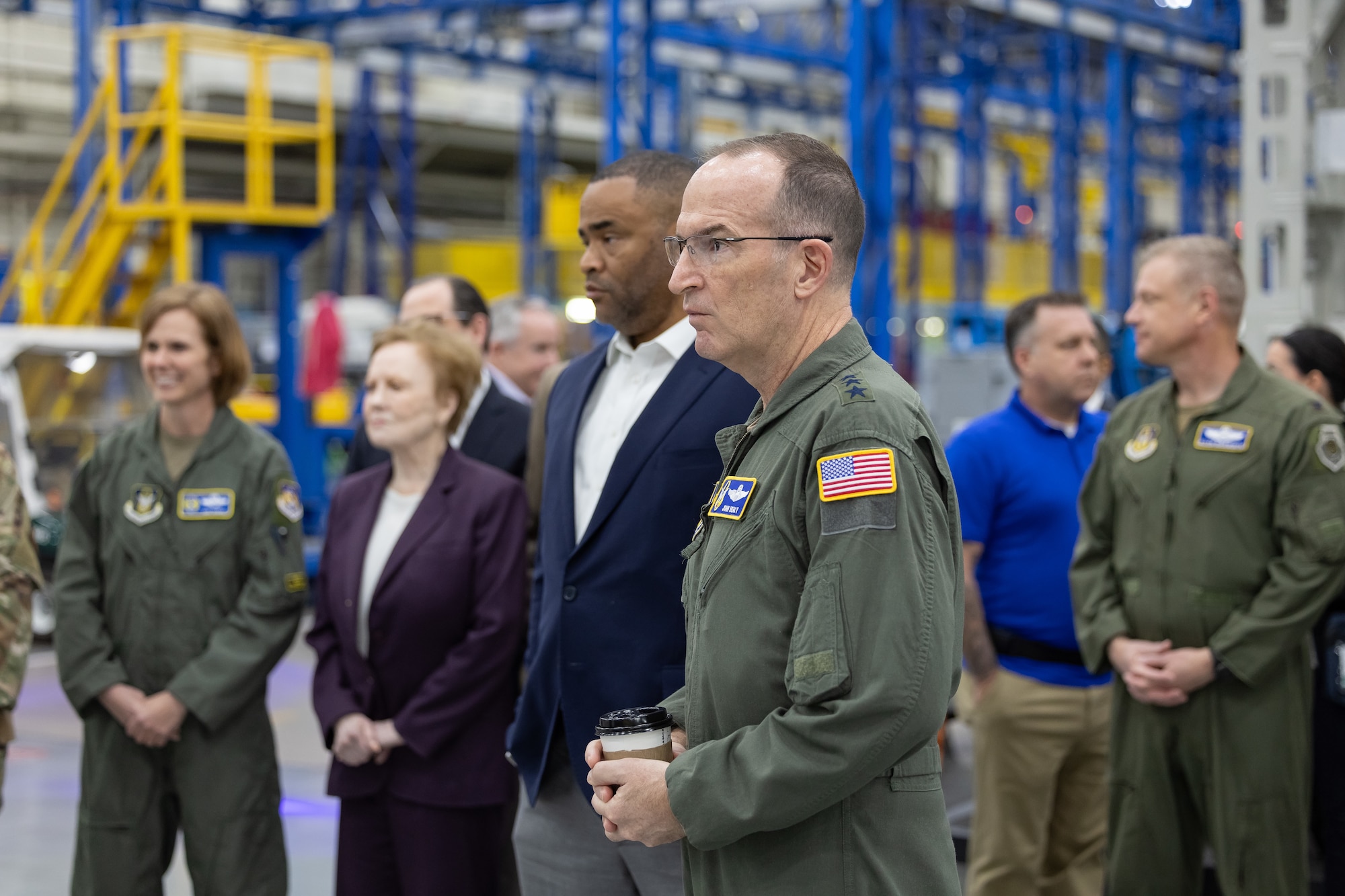In the Lockheed Martin F-35 production line, high-level defense dialogues materialize into action as Lt. Gen. John Healy and Brig. Gen. Gina Sabric, alongside congressional representatives Kay Granger and Marc Veasey, inscribe their commitment onto the bulkhead of the first F-35 Lightning II for the 301st Fighter Wing. This signing marks not just a transfer of technology but a strategic advance, reinforcing the Air Force Reserve Command's future readiness. (Photos courtesy of Lockheed Martin Aeronautics Company)