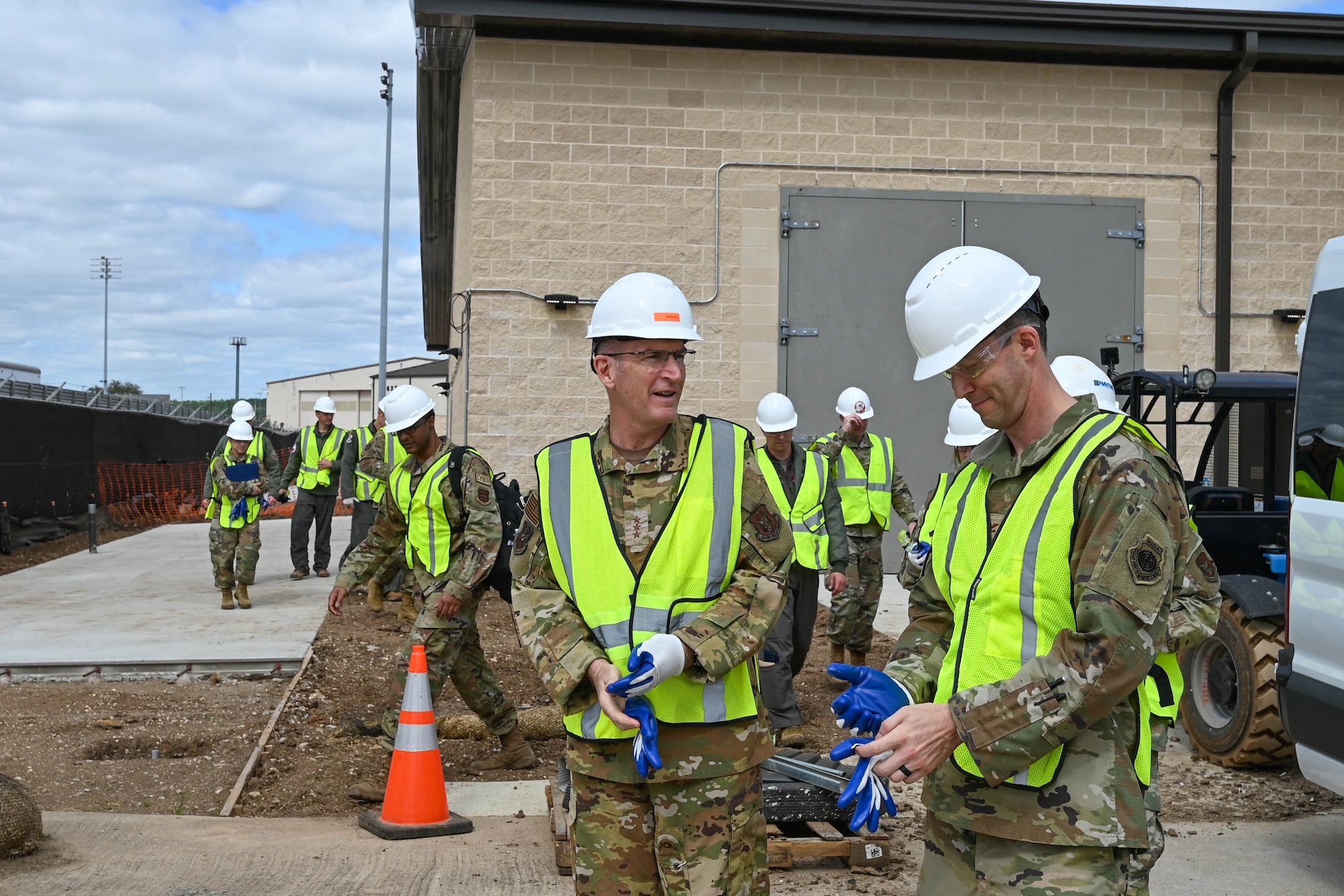 U.S. Air Force Lt. Gen. John Healy, left, chief of the Air Force Reserve (AFR) and commander of Air Force Reserve Command (AFRC), and Col. Benjamin Harrison, 301st Fighter Wing commander, exit construction area at Naval Air Station Joint Reserve Base Fort Worth, Texas April 2, 2024. AFRC leadership alongside 301st FW commanders toured facilities in preparation for the F-35 by the Program integration office. (U.S. Air Force photo by Nije Hightower)