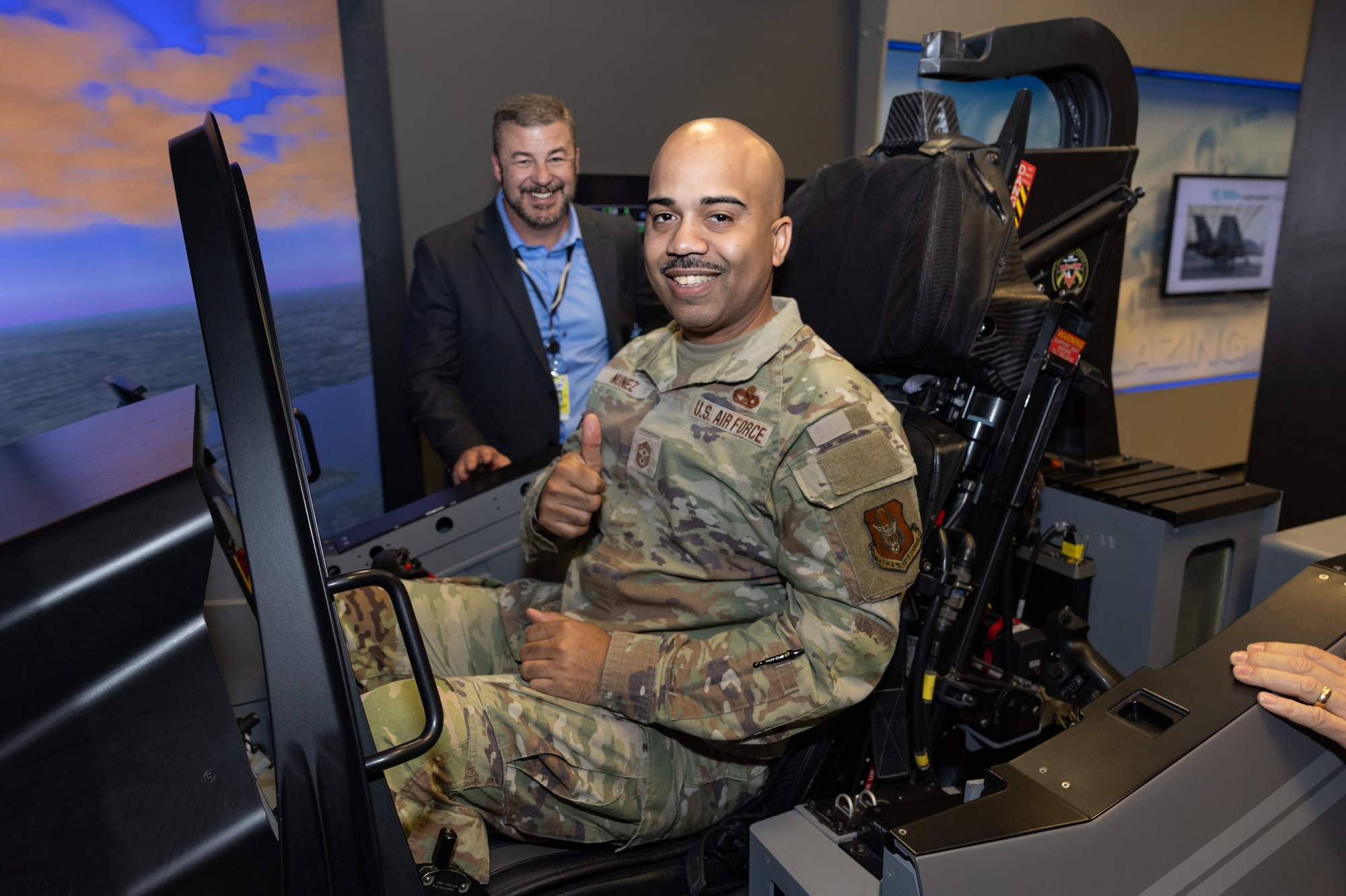 Command Chief Israel Nunez, at the helm of an F-35 simulator, delves into the capabilities of the Air Force Reserve Command's latest addition during his visit to the Lockheed Martin production facility April 3, 2024. (Photos courtesy of Lockheed Martin Aeronautics Company)