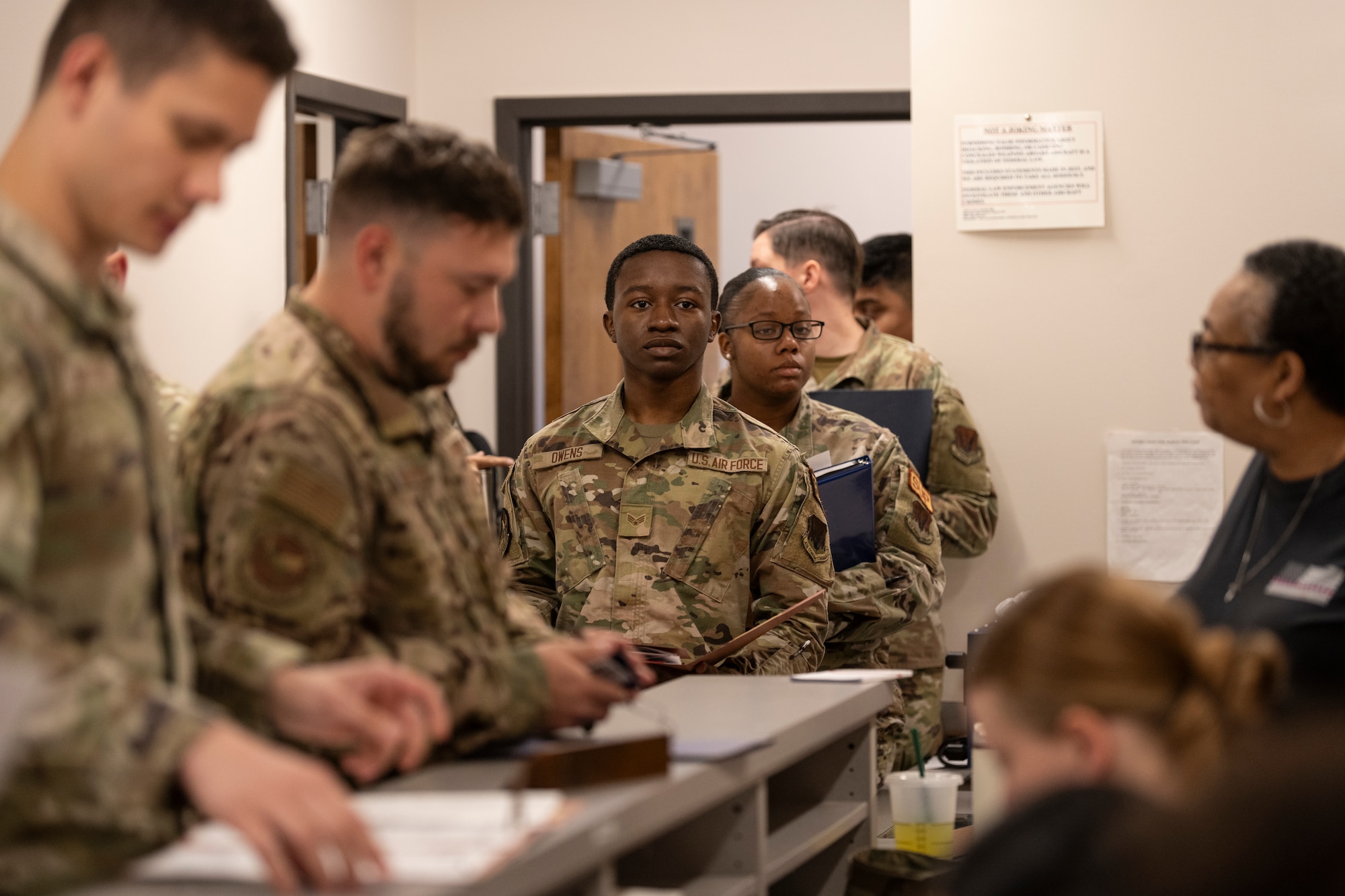 U.S. Air Force Airmen assigned to the 23rd Wing process through a personnel deployment function line for Exercise Ready Tiger