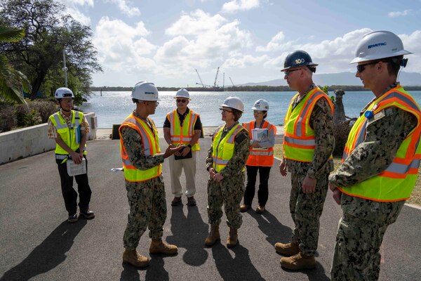 PEARL HARBOR, Hawaii - Chief of Naval Operations Adm. Lisa Franchetti meets with command leadership during a tour of Dry Dock 5 at the Pearl Harbor Naval Shipyard and Intermediate Maintenance Facility in Pearl Harbor, Hawaii, April 3. Franchetti was able to interact with Navy leadership and civilians working on the Navy’s largest maritime infrastructure construction project since World War II. (U.S. Navy photo by Chief Mass Communication Specialist Amanda Gray)