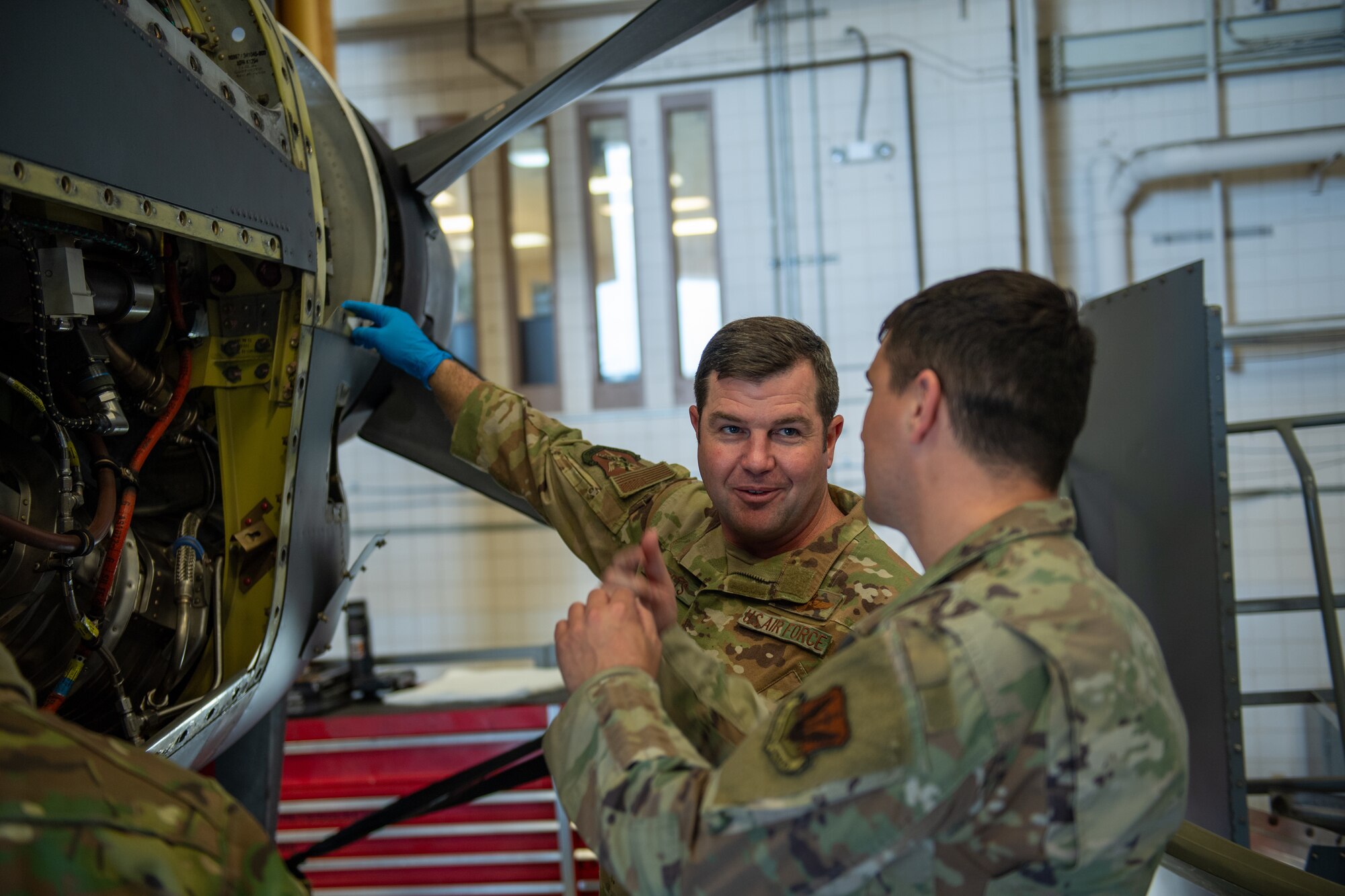 U.S. Air Force Col. Paul Sheets, 23rd Wing commander, works on the fourth engine of an HC-130J Combat King II at Moody Air Force Base, Georgia, March 25, 2024. During his time with the 71st RGS, Sheets conducted a borescope inspection on the engine as well as a combustion liner and turbine assembly. (U.S. Air Force photo by Airman Cade Ellis)
