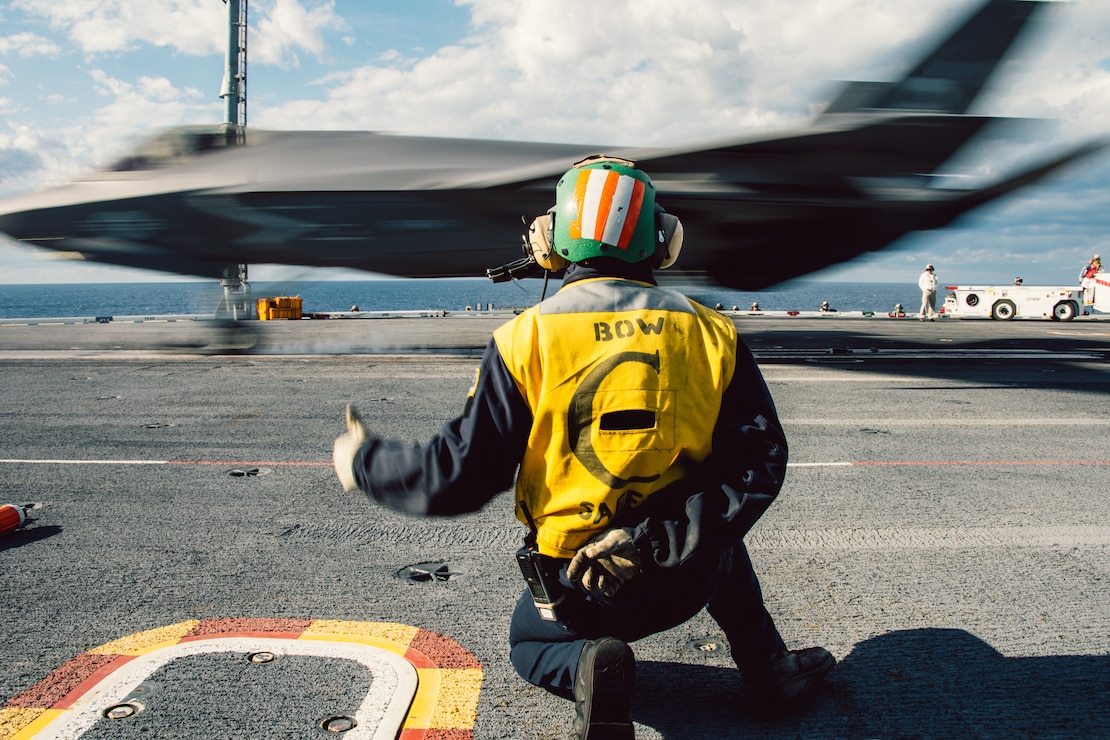 Aviation Boatswain’s Mate Launch/Recovery (Equipment) 1st Class Jared Midgett (AW), from Killeen, Texas, assigned to V-2 division in air department launches an F-35C Lightning II, from Strike Fighter Squadron (VFA) 147, on the flight deck of Nimitz-class aircraft carrier USS George Washington (CVN 73) Dec. 5, 2023. George Washington is underway in support of carrier qualifications. (U.S. Navy photo by Mass Communication Specialist 3rd Class August Clawson)