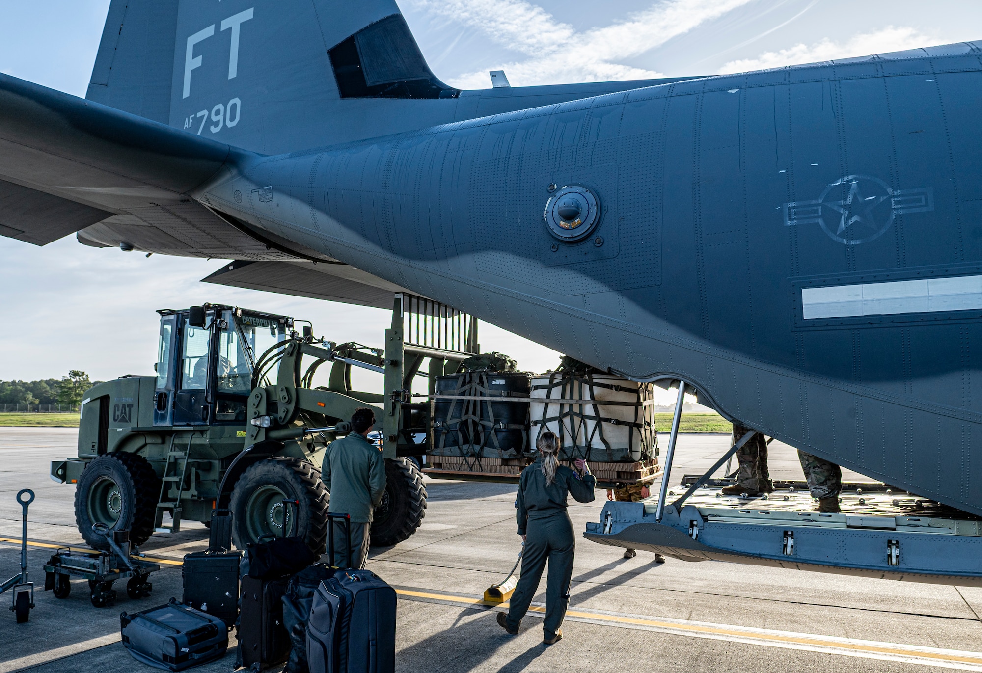 U.S. Air Force Airmen assigned to the 23rd Wing, load cargo into an HC-130J Combat King II at Moody Air Force Base, Georgia, March 25, 2024. After loading the aircraft, the Airmen traveled to Salina, Kansas, for the Rescue Rodeo, a rescue training event and competition organized by the 71st Rescue Squadron.  (U.S. Air Force photo by Airman 1st Class Leonid Soubbotine)