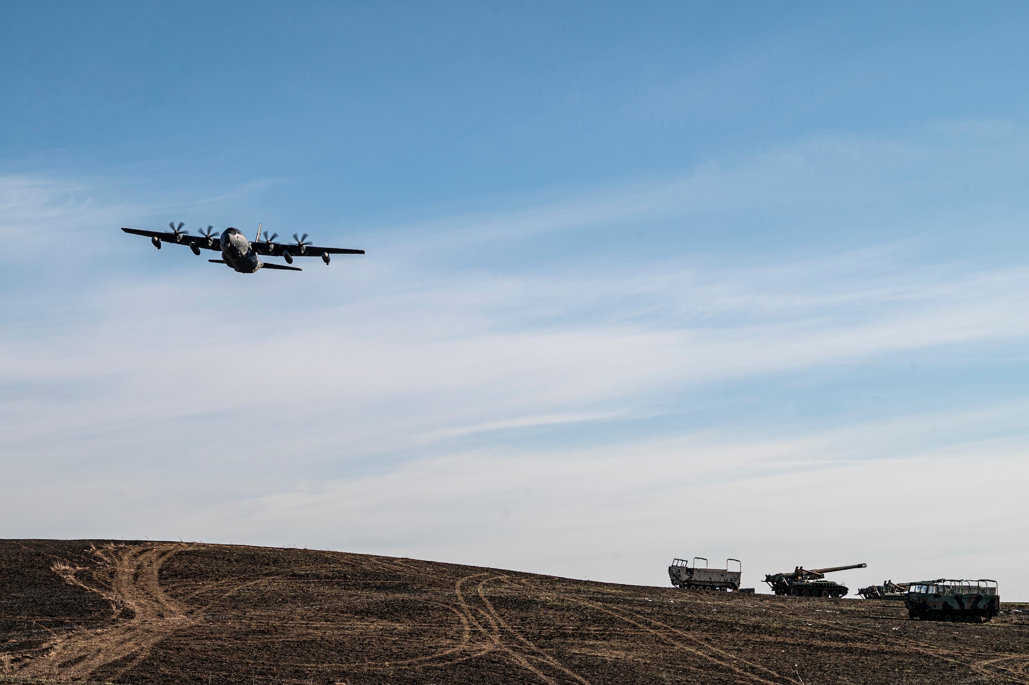U.S. Air Force rescue Airmen fly an HC-130J Combat King II over Smoky Hill Air National Guard Range, Kansas, March 26, 2024. The range spans across 34,000 acres and is the largest and busiest range in the Air National Guard. (U.S. Air Force photo by Airman 1st Class Leonid Soubbotine)