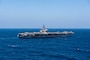 The aircraft carrier USS Dwight D. Eisenhower (CVN 69) sails in the Gulf of Aden, Dec.18, 2023. The Dwight D. Eisenhower Carrier Strike Group is deployed to the U.S. 5th Fleet area of operations to support maritime security and stability in the Middle East region. (U.S. Navy photo by Mass Communication Specialist 3rd Class Nicholas Rodriguez)