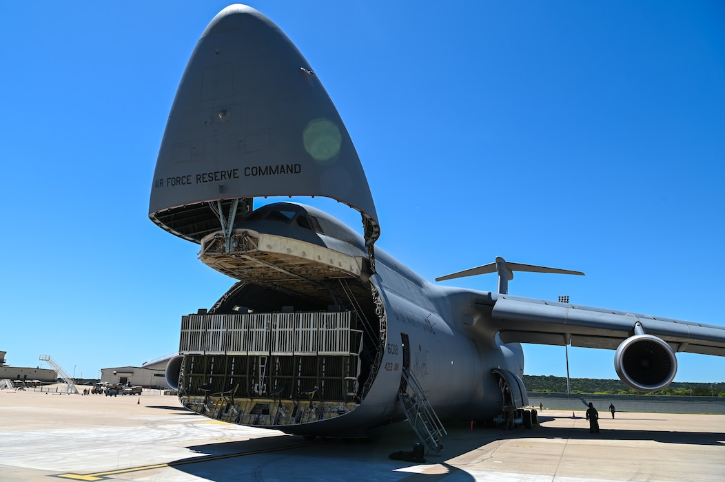433rd Airlift Wing air crew members open the front end of a C-5M Super Galaxy in preparation to upload an M1A2 Abrams Main Battle Tank at Robert Gray Army Airfield, Fort Cavazos, Texas on April 4th, 2024.