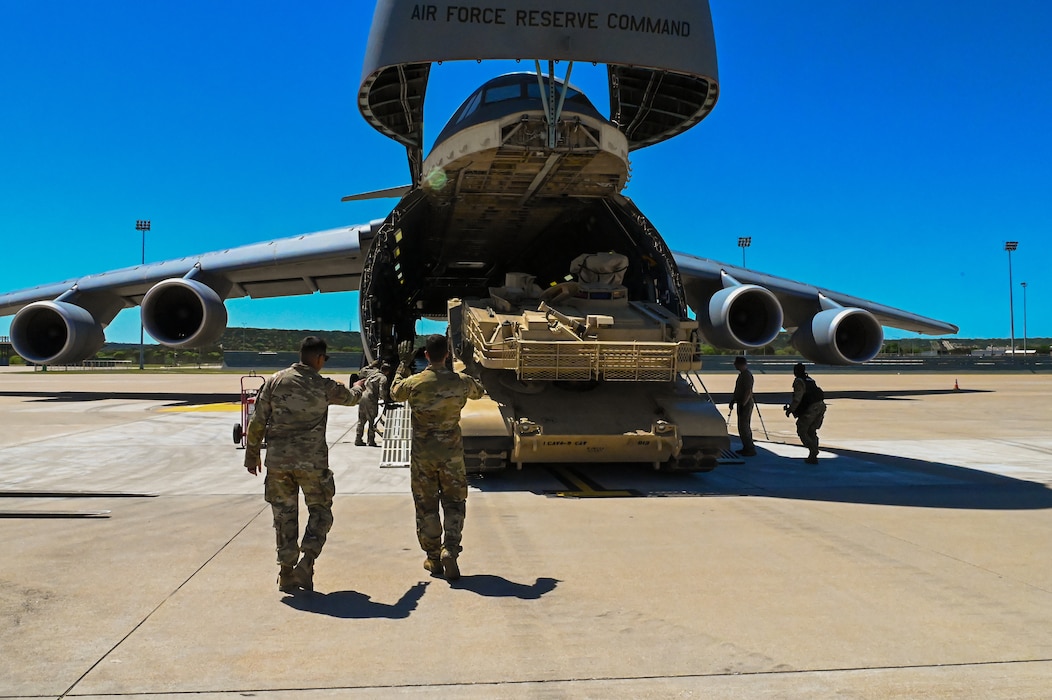 433rd Airlift Wing Reserve Citizen Airmen and 2nd Brigade 1st Cavalry Division Soldiers work together to load an M1A2 Abrams Main Battle Tank aboard a C-5M Super Galaxy at Robert Gray Army Airfield, Fort Cavazos, Texas on April 4th, 2024.