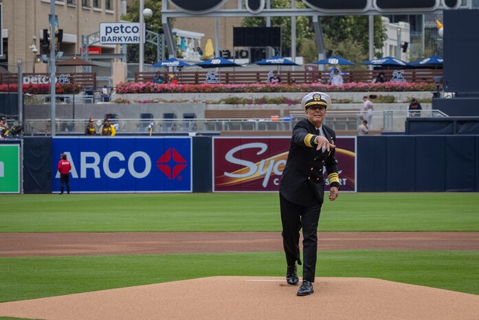 U.S. Navy Vice Adm. Daniel Cheever, commander Naval Air Forces and Naval Air Force U.S. Pacific Fleet, throws the first pitch during a Military Opening Day hosted by the San Diego Padres at Petco Park, San Diego, California, March 31, 2024. The Padres held the Military Opening Day before playing the San Francisco Giants. (U.S. Marine Corps photo by Lance Cpl. Jacob B. Hutchinson)
