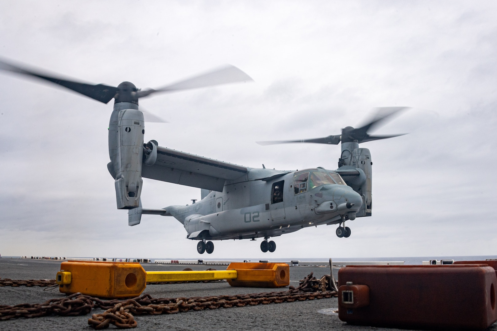 PHILIPPINE SEA (April 2, 2024) An MV-22B Osprey tiltrotor aircraft from Marine Medium Tiltrotor Squadron (VMM) 262, lands on the flight deck of the forward-deployed amphibious assault carrier USS America (LHA 6), while conducting routine operations in the Philippine Sea, April 2. America, lead ship of the America Amphibious Ready Group, is operating in the U.S. 7th Fleet area of operations. U.S. 7th Fleet is the U.S. Navy’s largest forward-deployed numbered fleet, and routinely interacts and operates with allies and partners in preserving a free and open Indo-Pacific region.  (U.S. Navy photo by Mass Communication Specialist 2nd Class Cole Pursley)