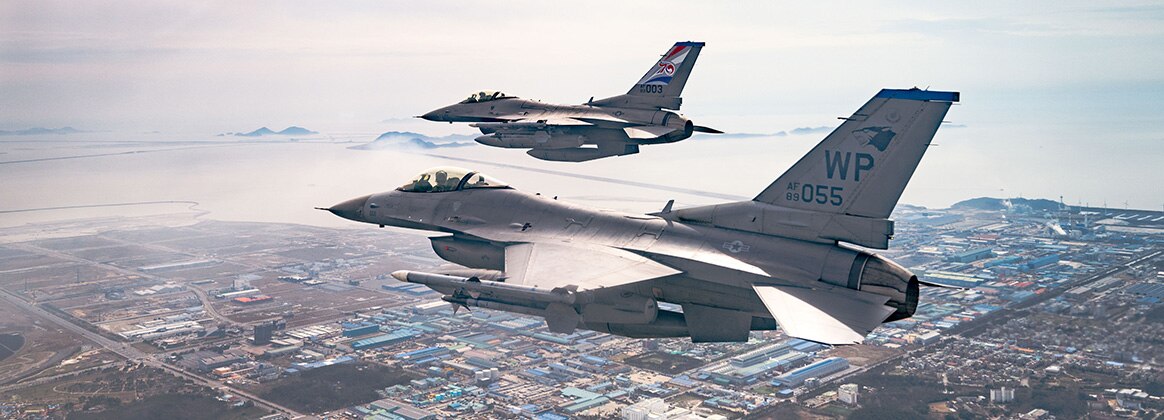 240402-F-DU706-1973 SOUTH KOREA (April 2, 2024) Two F-16 Fighting Falcons from the 35th Fighter Squadron, fly over the Republic of Korea’s southern coast, April 2, 2024. The 80th and 35th FS assigned to Kunsan Air Base, deliver airpower and showcase the United States’ commitment to the ironclad Alliance and stability in the U.S. Indo-Pacific Command area of responsibility. (U.S. Air Force photo by Senior Airman Karla Parra)