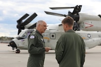 Rear Adm. Doug Verissimo, commander, Naval Air Force Atlantic, speaks with Cmdr. Mason Fox, executive officer of Fleet Logistics Multi-Mission Squadron (VRM) 40 the “Mighty Bison,” following the arrival of the first East Coast-assigned Navy tiltrotor vertical/short takeoff and landing (V/STOL) aircraft CMV-22B Osprey at Naval Station Norfolk, April 5. The CMV-22B airframe will provide the fleet’s medium-lift and long-range aerial logistics capability, replacing the C-2A Greyhounds of Fleet Logistics Support Squadron (VRC) 40 over the next several years.