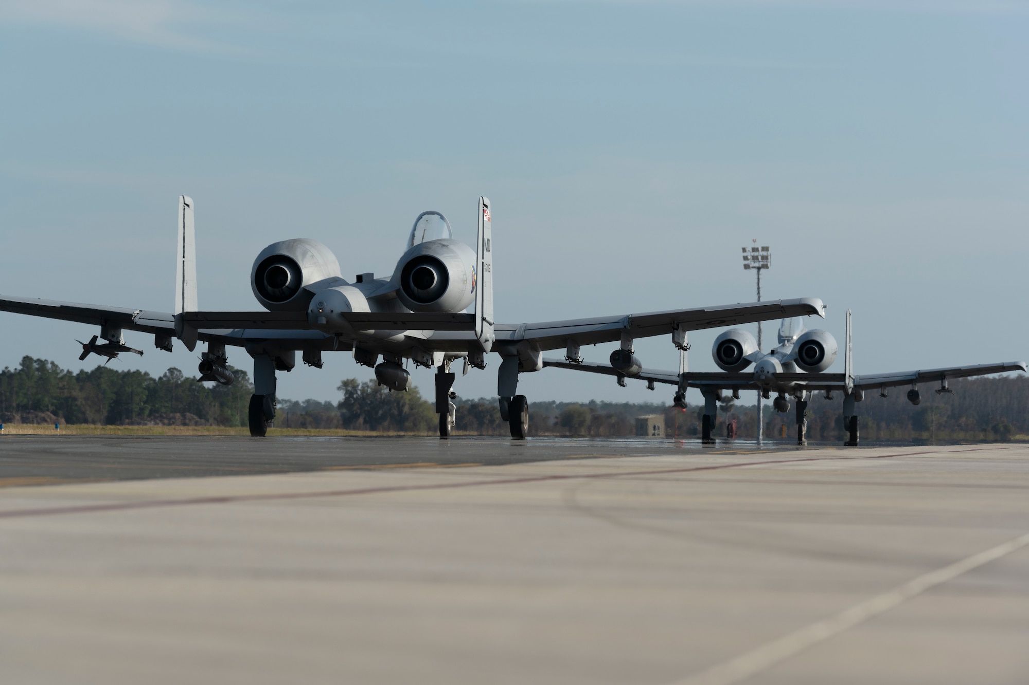 Two U.S. Air Force A-10 Thunderbolt II aircrafts, depart the airfield as part of agile combat employment during the Agile Rage exercise, Avon Park, Florida, Feb. 27, 2024. Agile Rage 2024 is a National Guard Bureau (NGB)/A3 led military exercise, hosted at the Air Dominance Center, taking place from February 26 to March 8, 2024 that involves the collaborative efforts of various Air National Guard Wings conducting joint counter-land and combat search and rescue (CSAR) operations in a simulated medium to high threat environment. (U.S. Air National Guard photo by Master Sgt. Rafael D. Rosa)