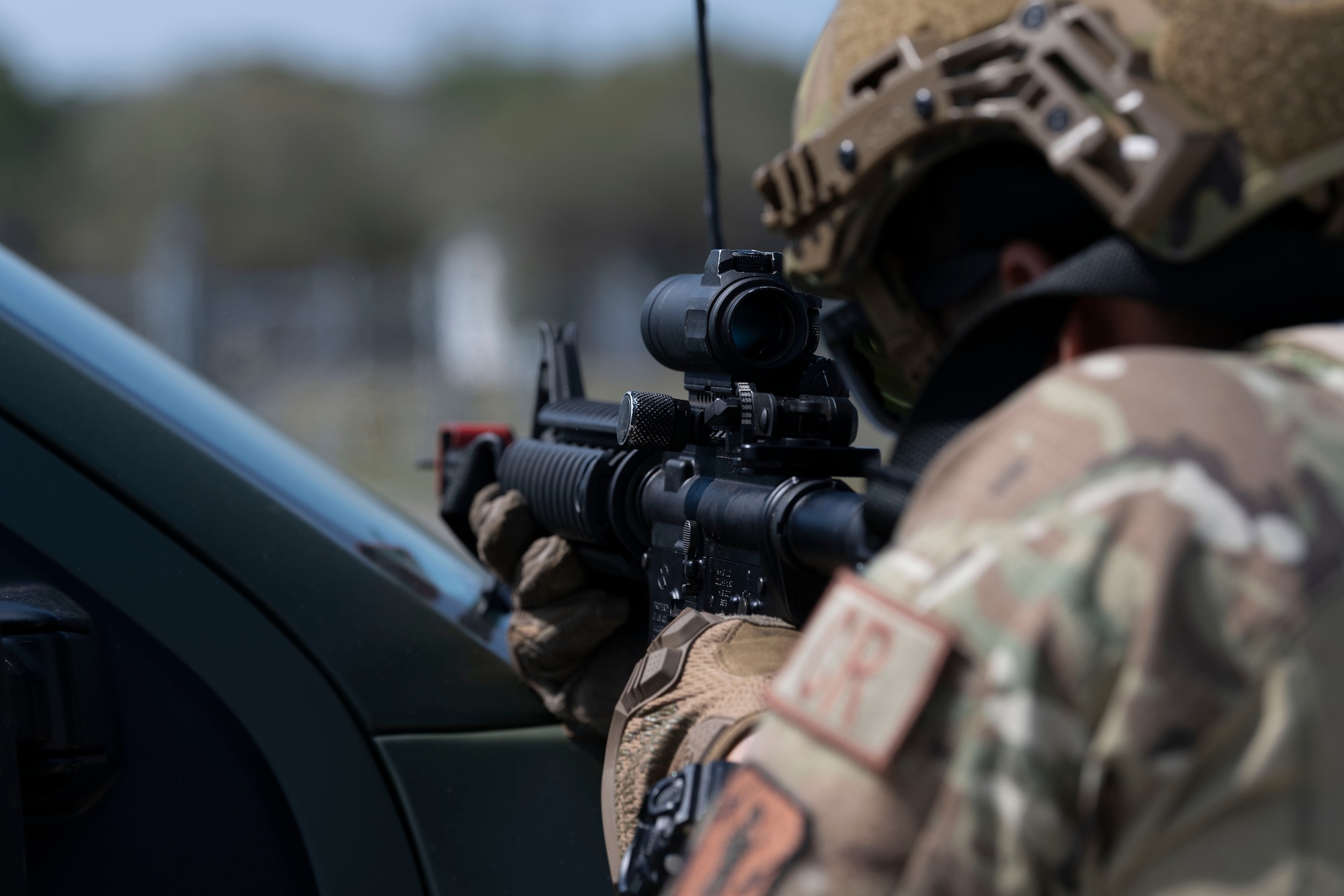 A U.S. Airman with the 156th Contingency Response Group, Puerto Rico Air National Guard, aims at opposing forces in support of agile combat employment operations during the Agile Rage exercise, Avon Park, Florida, Feb. 28, 2024. Agile Rage 2024 is a National Guard Bureau (NGB)/A3 led military exercise, hosted at the Air Dominance Center, taking place from February 26 to March 8, 2024 that involves the collaborative efforts of various Air National Guard Wings conducting joint counter-land and combat search and rescue (CSAR) operations in a simulated medium to high threat environment. (U.S. Air National Guard photo by Master Sgt. Rafael D. Rosa)