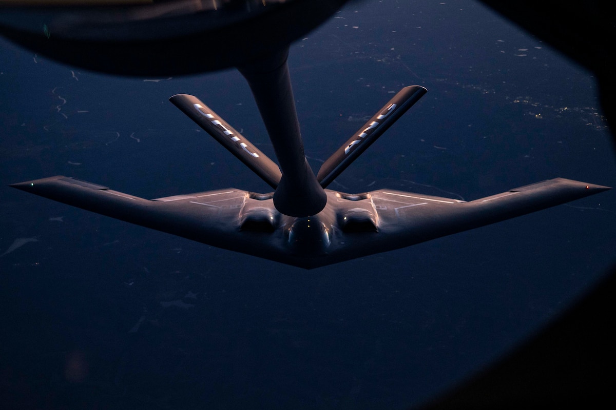A KC-135 Stratotanker refuels a B-2 Spirit