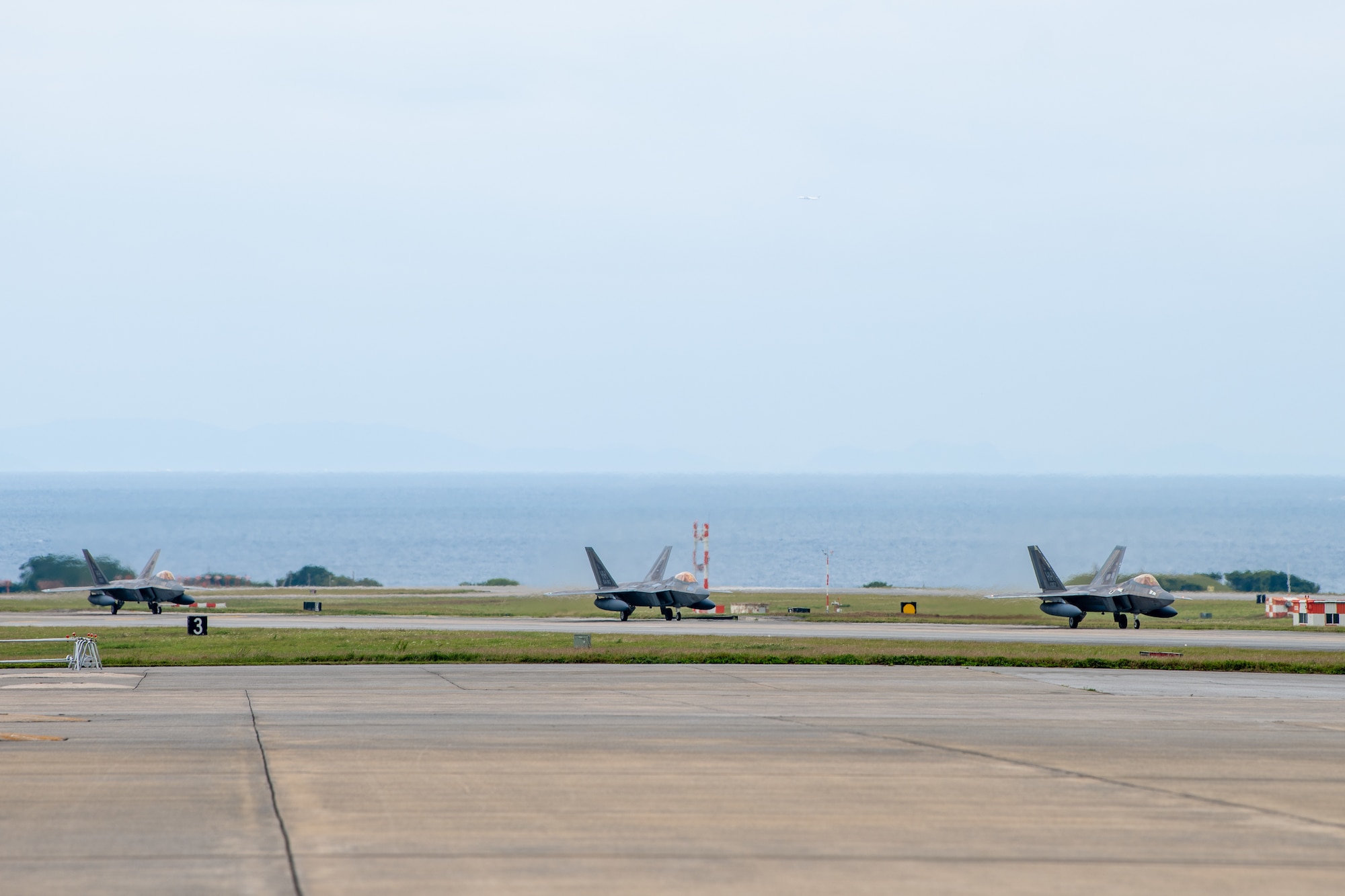 U.S. Air Force F-22A Raptors, operated by the 199th and 19th Fighter Squadrons, land at Kadena Air Base.