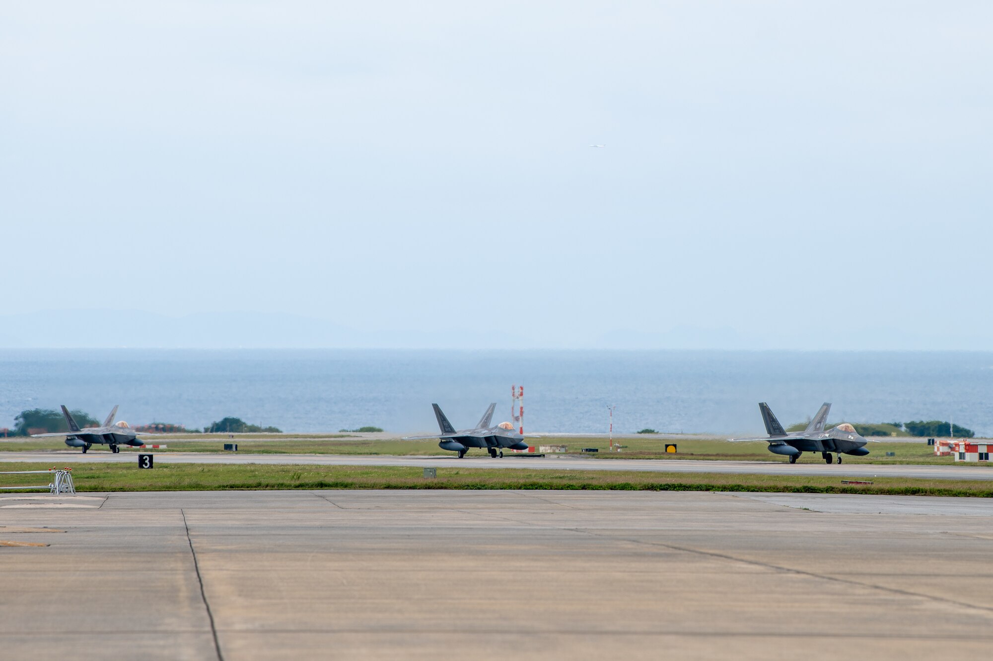 U.S. Air Force F-22A Raptors, operated by the 199th and 19th Fighter Squadrons, land at Kadena Air Base.