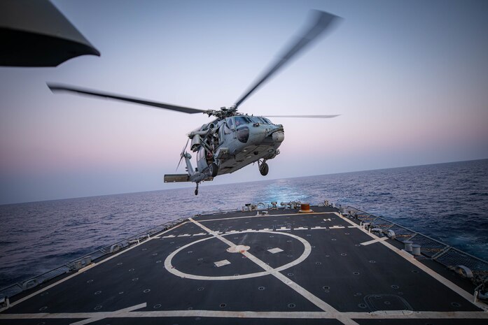 231012-N-GF955-1650 EASTERN MEDITERRANEAN SEA (Oct. 12, 2023) An MH-60S Sea Hawk helicopter assigned to the “Tridents” of Helicopter Sea Combat Squadron (HSC) 9 lands on the flight deck of the Arleigh Burke-class guided-missile destroyer USS Carney (DDG 64), October 12, 2023. Carney is currently a part of the Gerald R. Ford Carrier Strike Group. The strike group is on a scheduled deployment in the U.S. Naval Forces Europe area of operations, employed by the U.S. Sixth Fleet to defend U.S., allied, and partner interests. (U.S. Navy photo by Mass Communication Specialist 2nd Class Aaron Lau)