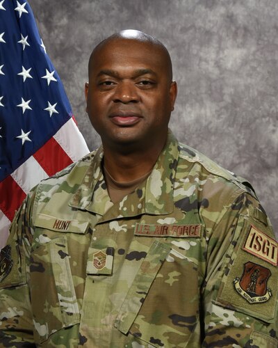 U.S. Air Force Senior Master Sgt. Cedric Hunt, first sergeant for the 117th Air Refueling Wing, poses for an official photograph at Sumpter Smith JNGB, Ala., Dec. 02, 2023. (U.S. Air National Guard photo by Airman 1st Class Kasie Faddis)