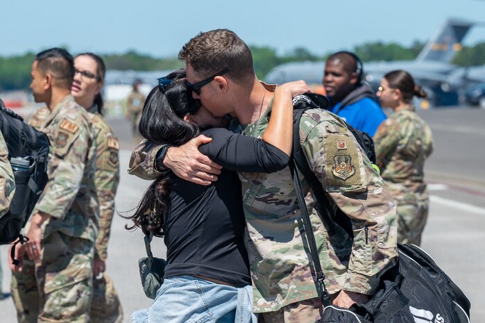 A photo of two people hugging.