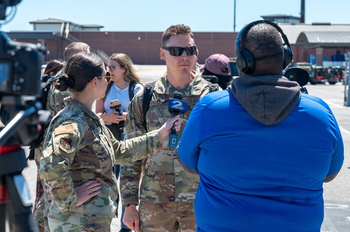 A photo of an Airman being interviewed.