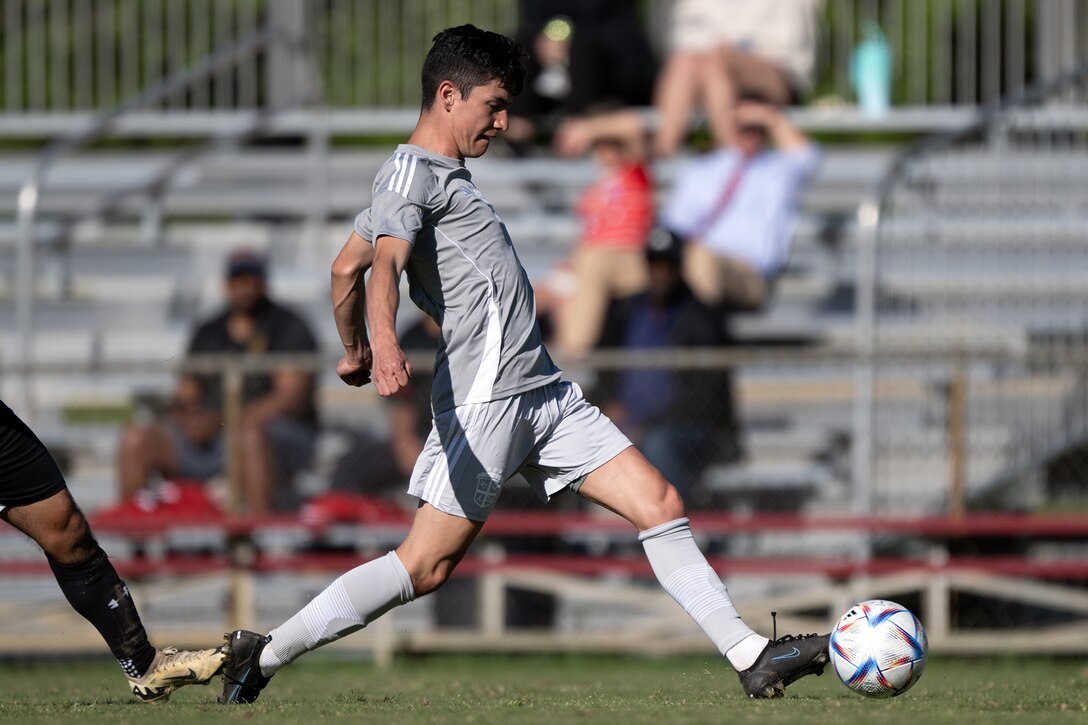 Air Force 2d lt. Jacob Angeletti of FE Warren AFB, Wy. drives down the field during the first match of the 2024 Armed Forces Men's Soccer Championship hosted by Marine Corps Logistics Base Albany, Georgia at Albany State University from April 2-10. The Armed Forces Championship features teams from the Army, Marine Corps, Navy (with Coast Guard players), and Air Force (with Space Force players). (DoD photo by EJ Hersom)