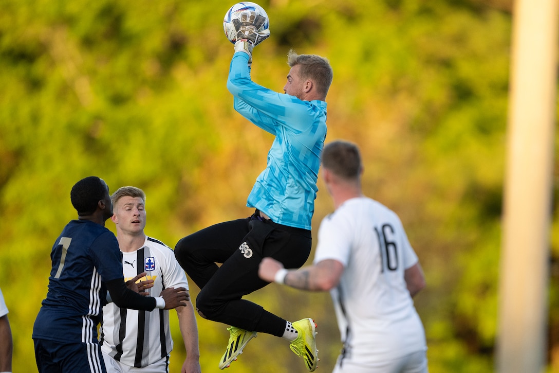Army goalkeeper Spc. James May of Fort Liberty, N.C. grabs the ball in the air during their match against Navy of the 2024 Armed Forces Men's Soccer Championship hosted by Marine Corps Logistics Base Albany, Georgia at Albany State University from April 2-10. The Armed Forces Championship features teams from the Army, Marine Corps, Navy (with Coast Guard players), and Air Force (with Space Force players). (DoD photo by EJ Hersom)