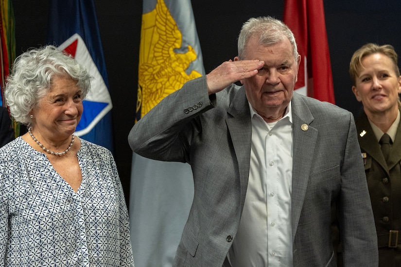 Retired U.S. Army Brig. Gen. Donald Canaday salutes Vietnam War-era veterans as his wife, Sharon, and Brig. Gen. Paige M. Jennings, U.S. Army Financial Management Command commanding general, look on during USAFMCOM’s Vietnam War commemoration at the Maj. Gen. Emmett J. Bean Federal Center in Indianapolis March 25, 2024. Canaday enlisted in the U.S. Army infantry in 1954, attended Officer Candidate School, commanded two artillery batteries, served in Vietnam from 1964-1965 as a senior advisor of a South Vietnamese infantry battalion, and served as commander of President Gerald Ford’s amnesty program of Vietnam deserters at Camp Atterbury, Indiana. (U.S. Army photo by Mark R. W. Orders-Woempner)