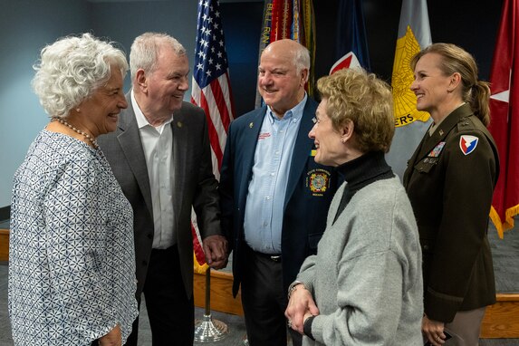 Retired U.S. Army Brig. Gen. Donald Canaday and his wife, Sharon, left, talk with Richard Leirer and his wife, Terri, center, talk with Brig. Gen. Paige M. Jennings, U.S. Army Financial Management Command commanding general, look on during USAFMCOM’s Vietnam War commemoration at the Maj. Gen. Emmett J. Bean Federal Center in Indianapolis March 25, 2024. The command welcomed home 15 Indiana Vietnam War-era veterans during the ceremony. (U.S. Army photo by Mark R. W. Orders-Woempner)