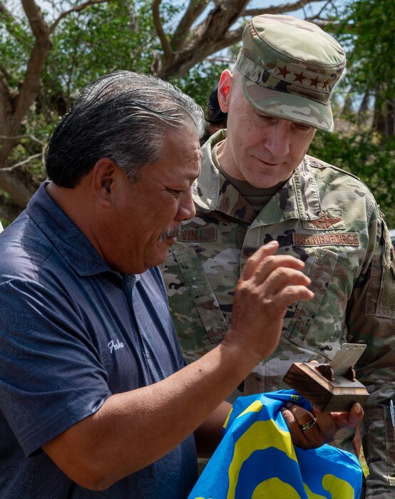 The Honorable Mayor of Tinian and Aguiguan, Edwin P. Aldan gives U.S. Air Force Chief of Staff Gen. David Allvin a gift to welcome him to the island of Tinian, April 4, 2024. While in Tinian, leadership gained first-hand knowledge of how the 356th Expeditionary Civil Engineering Group has been working with the Tinian government for implementing change to further agile combat employment and how relationships with neighboring islands are paramount to the Air Force’s future success in Great Power Competition. (U.S. Air Force photo by Airman 1st Class Audree Campbell)