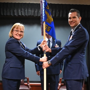 (Left to right) Col. Cynthia Welch, 931st Air Refueling Wing commander, passes the guidon to Lt. Col. Kevin Fowler, incoming commander of the 931st Operations Support Squadron, April 6, 2024, McConnell Air Force Base, Kansas.