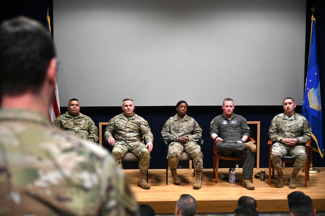 An Airman from the 433rd Airlift Wing poses a question to a group of Chief Master Sergeants at the Chief's Group Panel Discussion at Joint Base San Antonio-Lackland, Texas, April 7, 2024. The senior enlisted leaders hosted the event during the April Unit Training Assembly, encouraging open dialogue and bridging the gap between the senior enlisted leaders and Alamo Wing Airmen. (U.S. Air Force photo by Master Sgt. Mike Lahrman)
