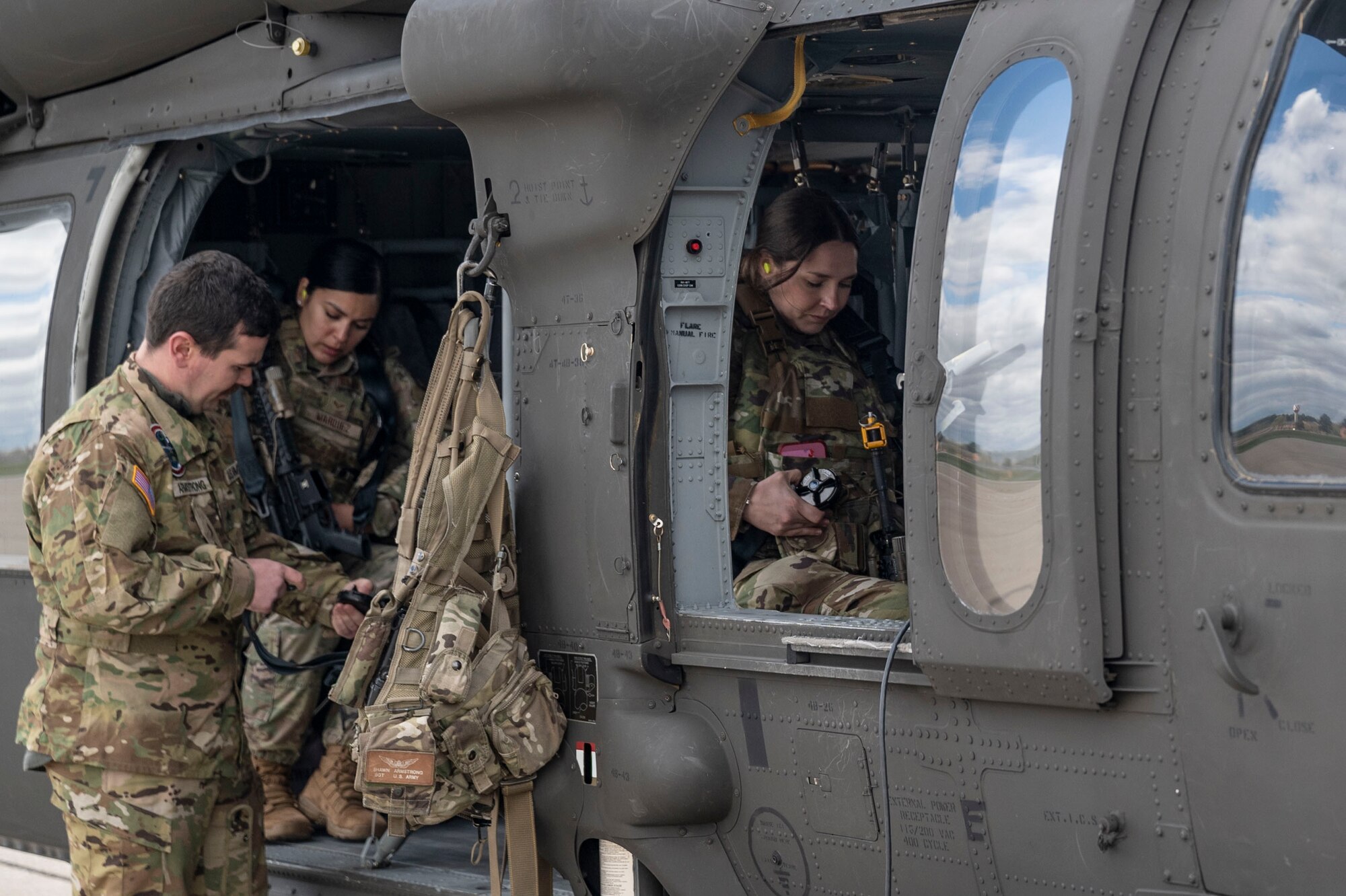 Citizen Airmen of the 932nd Airlift Wing prepare to take off on a HH-60 Helicopter operated by the Illinois Army National Guard’s 1st Assault Helicopter Battalion, 106th Aviation Regiment, based in Peoria, Illinois at Scott Air Force Base, Illinois. The Spartan Phase II exercise aims to prepare airmen for complexities of modern warfare through recreating the challenges in a deployed environment. (U.S. Air Force photo by Senior Airman Jon Stefanko)