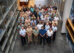 President Surangel Whipps of Palau, front (blue shirt), poses for a group photo while attending an executive level joint committee meeting at the National Oceanic and Atmospheric Administration building in Pearl Harbor, Hawaii, March 20. Under the 1994 Compact of Free Association agreement, the U.S. and Palau sustain deep ties and cooperation on a broad range of matters. (U.S. Navy photo by Petty Officer 1st Class John Bellino)