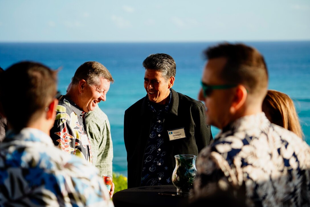 Brig. Gen. Neil Richardson, the J5 deputy Plans and Policy Division at U.S. Indo-Pacific Command, talks with Palau President Surangel S. Whipps Jr. during a reception at the Diamond Head Lighthouse for fellowship following the working meetings in Honolulu, Hawaii, on March 20, 2024. This strategic engagement, part of a series of bilateral discussions aimed at bolstering mutual defense and security initiatives, saw key representatives from both nations deliberating on a wide range of topics crucial to the partnership. (U.S. Coast Guard photo by Petty Officer 3rd Class Jennifer Nilson)