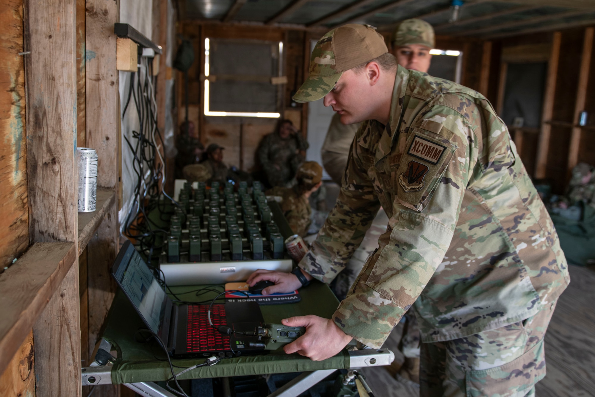 TSgt. Schrader, a Guard Airmen of the 182nd Airlift Wing, conducted a radio check during phase 2 of the Spartan Reserve exercise on April 6th, 2024 at Sparta Training Area, Illinois. The Spartan Phase II exercise demonstrated strength, teamwork, and efficiency through collaborative efforts during the Spartan Reserve Phase II exercise.(U.S. Air Force photo by Staff Sgt. Brooke Spenner)