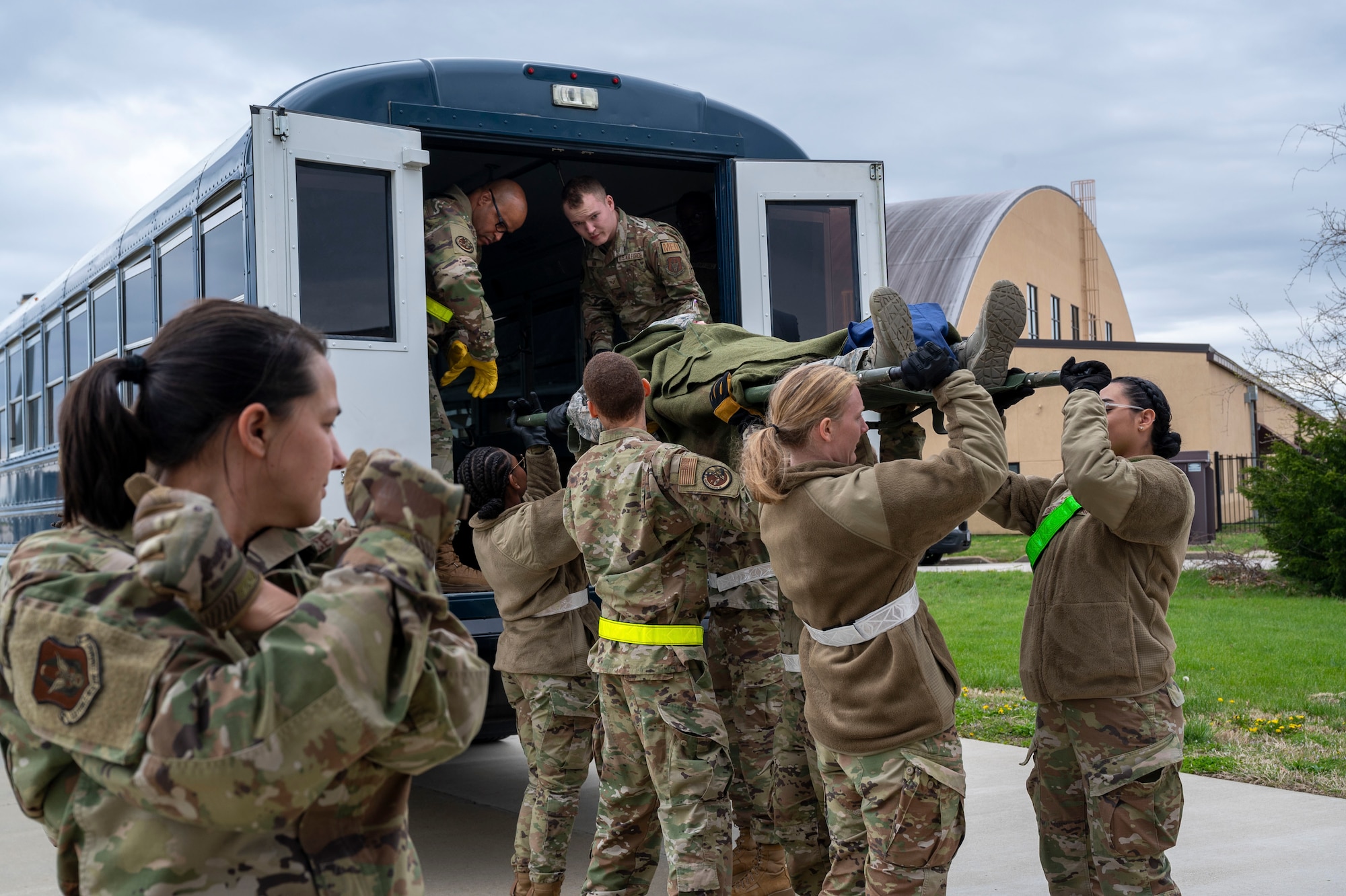 Airmen from the 932nd Aeromedical Evacuation Squadron and the 932nd Aeromedical Staging Squadron help load a patient onto a bus during the Spartan Reserve exercise at Scott Air Force Base, Illinois on April 7, 2024. The Spartan Reserve Phase II exercise aims to prepare airmen for complexities of modern warfare through recreating the challenges in a deployed environment. (U.S. Air Force Photo by Tech. Sgt. Kari Siltz)