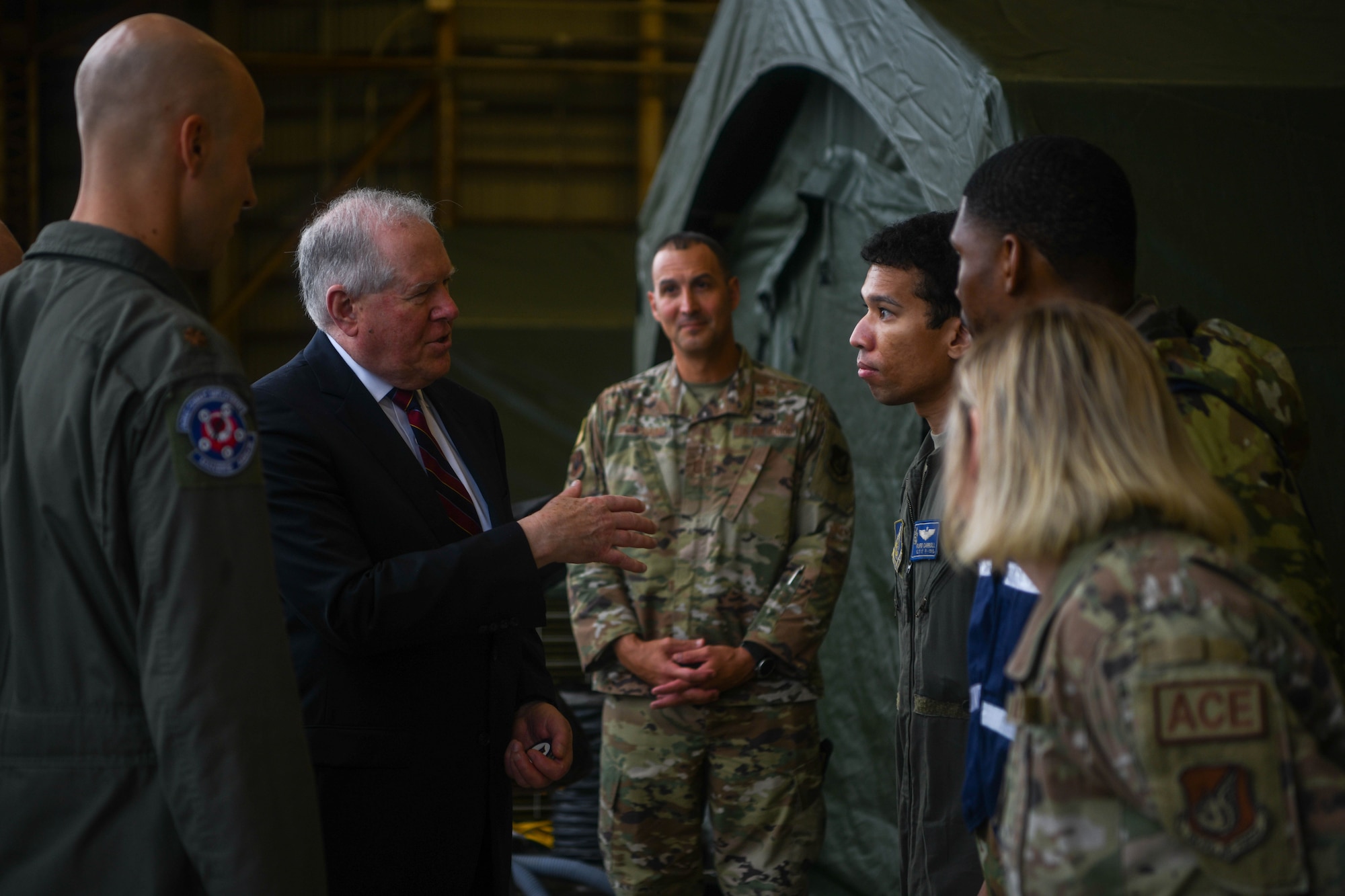 SecAF coins an Airman.