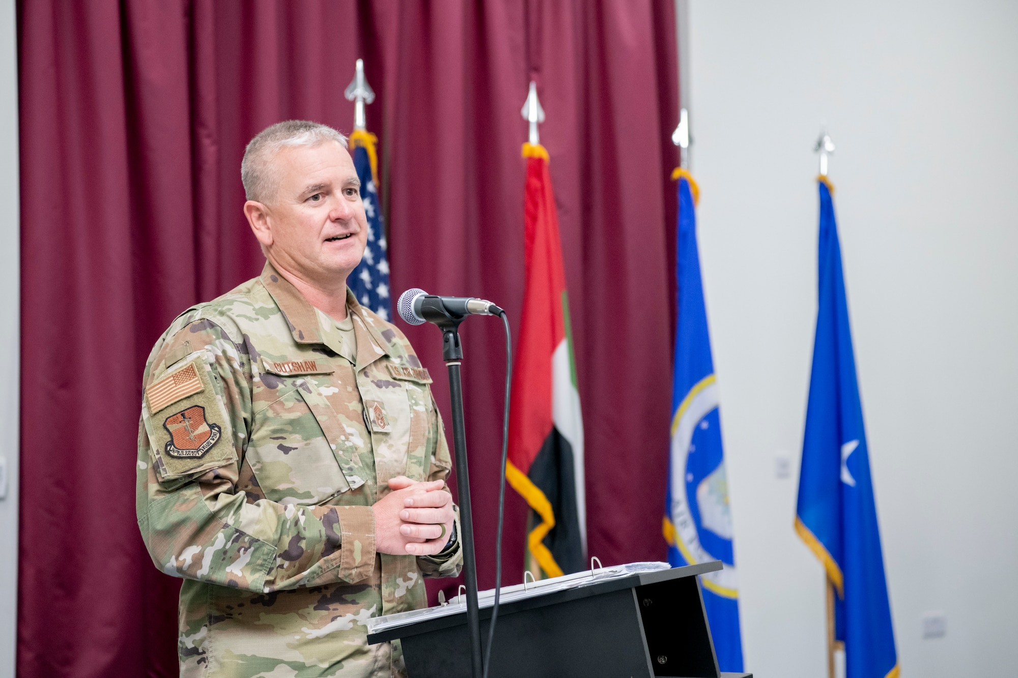 U.S. Air Force Command Chief Master Sgt. J. Stacy Cutshaw, command chief of the 380th Air Expeditionary Wing, gives remarks to members of the 380th AEW during a combined change of command and change of responsibility ceremony at an undisclosed location within the U.S. Central Command area of responsibility, April 1, 2024.