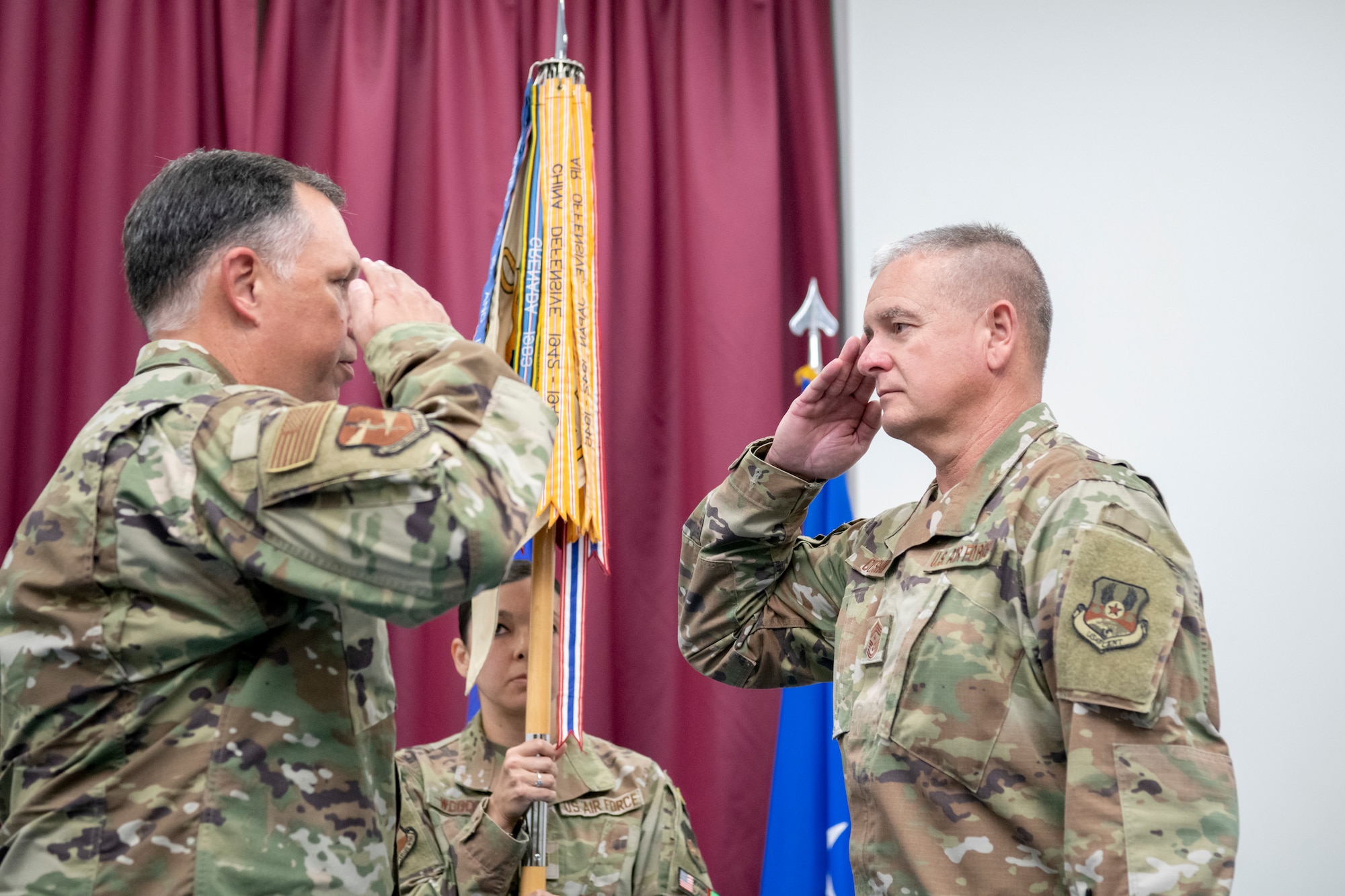 U.S. Air Force Chief Master Sgt. J. Stacy Cutshaw, assigned to the 380th Air Expeditionary Wing, salutes Col. Ronald Selvidge, 380th AEW commander, before assuming responsibility as the new command chief, during a combined change of command and change of responsibility ceremony at an undisclosed location, April 1, 2024.