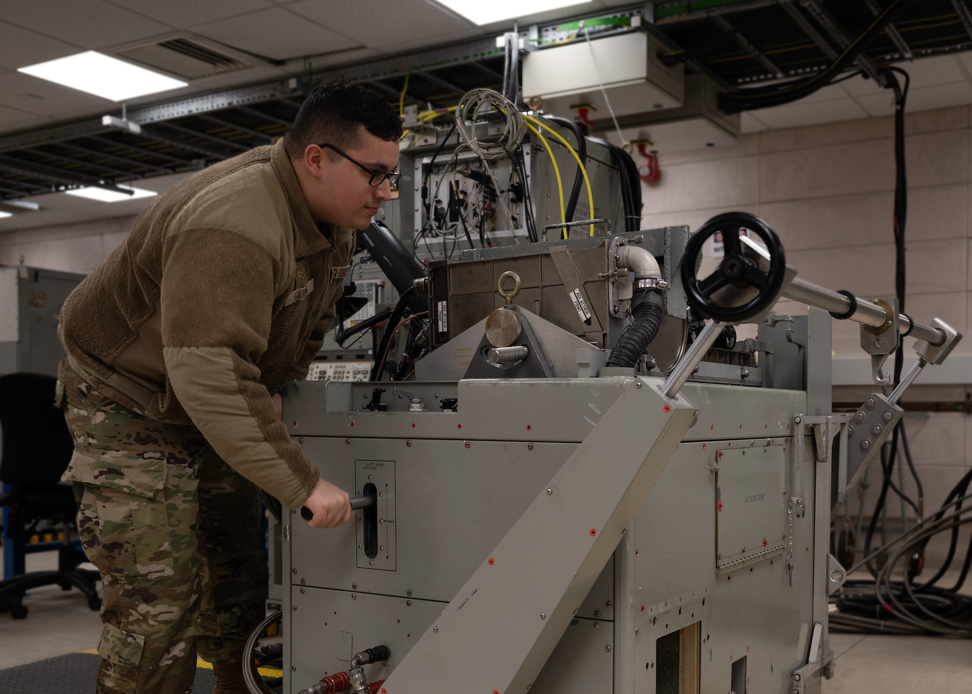 U.S. Air Force Airman 1st Class Alexander Garcia, 48th Component Maintenance Squadron Enhanced Aircraft Radar Test Station technician, performs final checks on the 111-Transmitter.